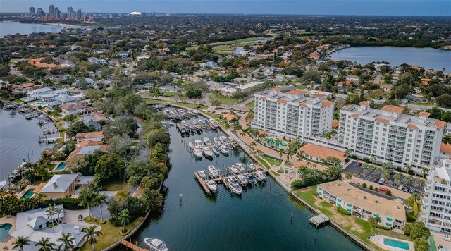 birds eye view of property featuring a water view and a city view