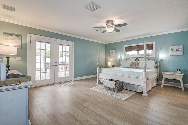 bedroom with access to outside, french doors, visible vents, and multiple windows