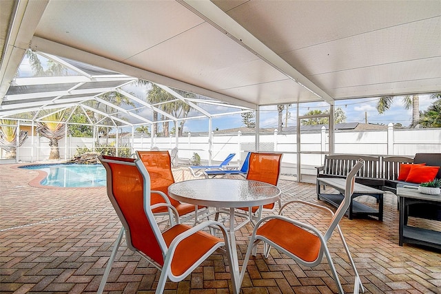 view of patio featuring a fenced in pool, glass enclosure, a fenced backyard, and outdoor lounge area