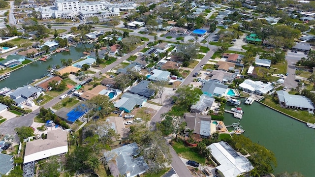 birds eye view of property featuring a water view and a residential view