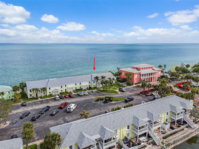 birds eye view of property with a water view and a residential view