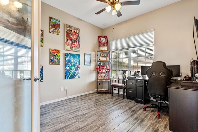 office space featuring ceiling fan, baseboards, and wood finished floors