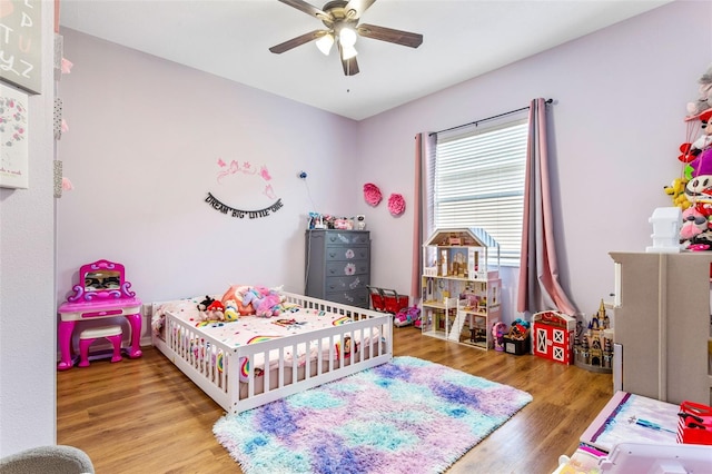 bedroom featuring a ceiling fan and wood finished floors