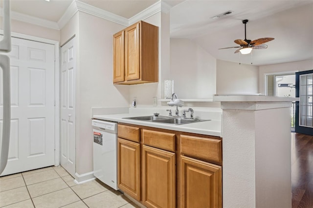 kitchen featuring crown molding, ceiling fan, light countertops, light tile patterned floors, and white dishwasher