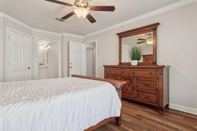 bedroom with visible vents, baseboards, dark wood finished floors, ornamental molding, and a ceiling fan