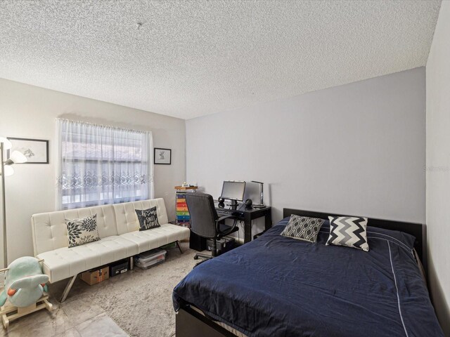 bedroom featuring a textured ceiling