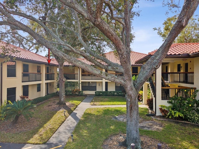 view of home's community with a lawn