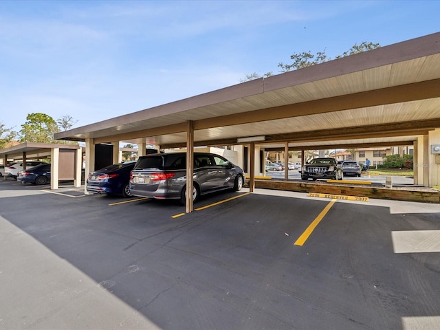 view of partially covered parking lot