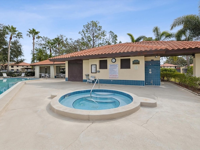 community pool with a patio