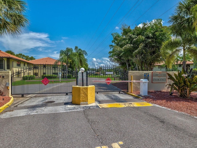 view of street featuring a gate and a gated entry