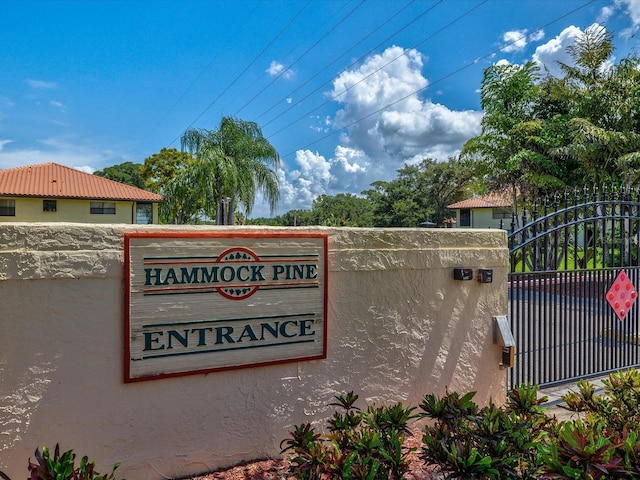 community sign featuring fence