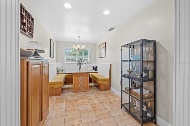 dining space featuring visible vents, baseboards, breakfast area, a chandelier, and recessed lighting