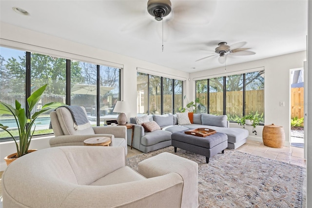 sunroom / solarium with plenty of natural light and ceiling fan