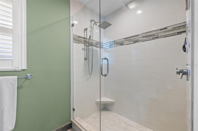 bathroom featuring a shower stall