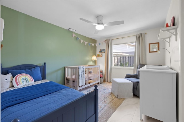 bedroom with a ceiling fan and visible vents