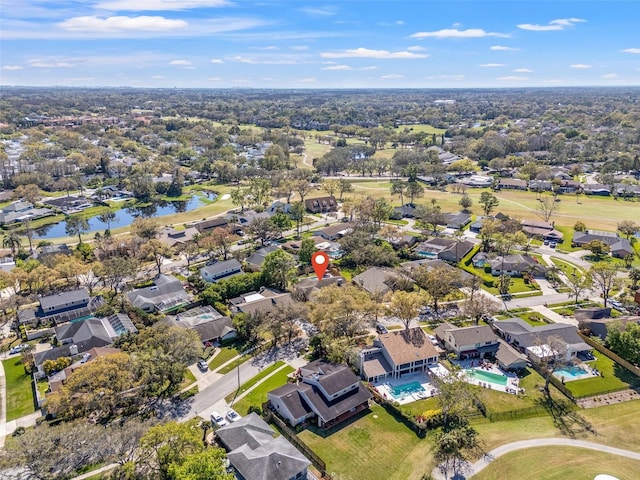 birds eye view of property featuring a water view and a residential view