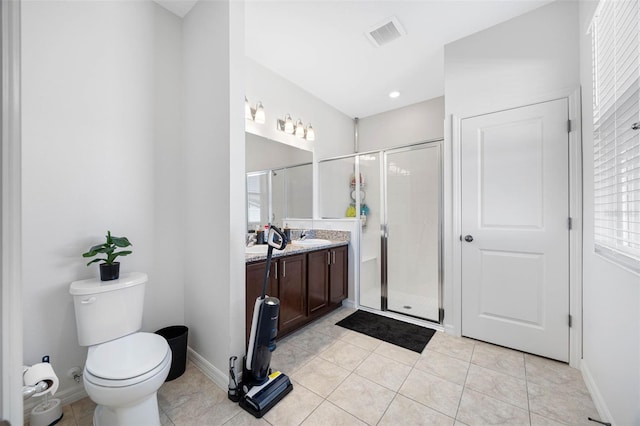 bathroom featuring toilet, a shower stall, tile patterned flooring, and vanity