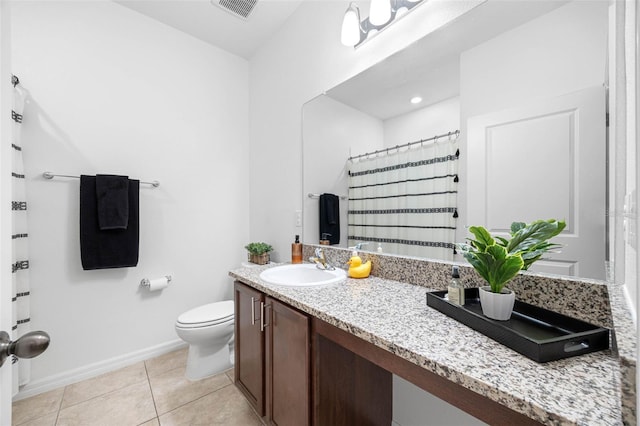 bathroom with visible vents, baseboards, toilet, tile patterned flooring, and vanity