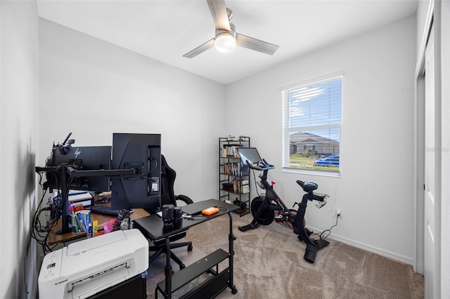 office area with ceiling fan, carpet floors, and baseboards