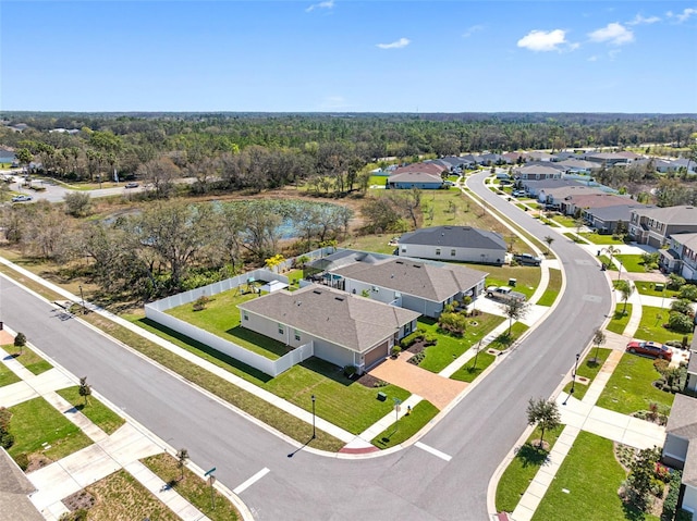 aerial view with a residential view and a view of trees