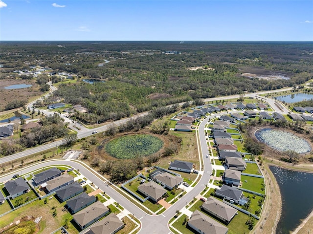 bird's eye view with a residential view and a water view