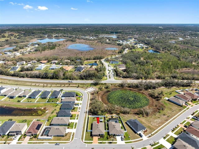 birds eye view of property featuring a residential view and a water view