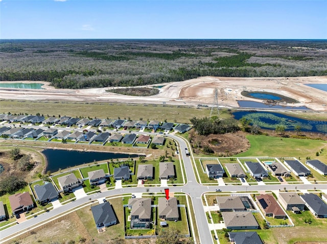 aerial view with a residential view and a water view