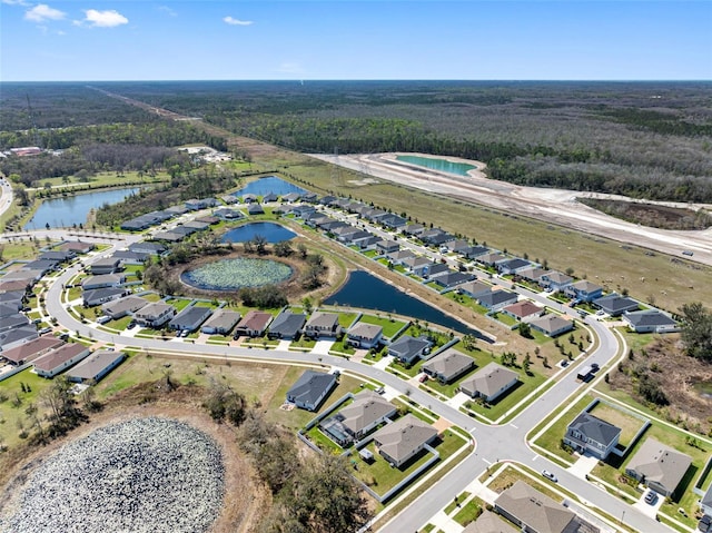 bird's eye view with a residential view and a water view