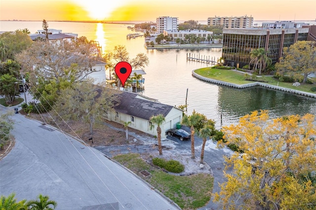 birds eye view of property featuring a water view