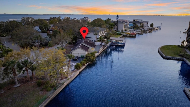 aerial view at dusk with a water view