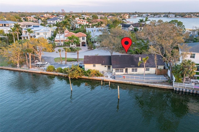 bird's eye view featuring a water view and a residential view