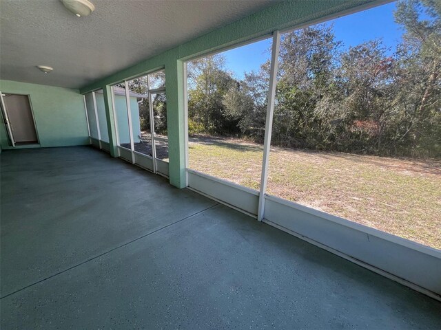 unfurnished sunroom featuring a wealth of natural light