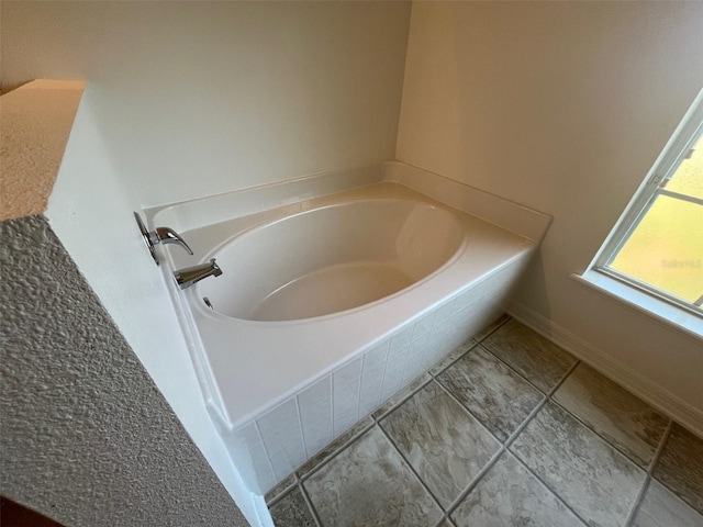 bathroom with a garden tub