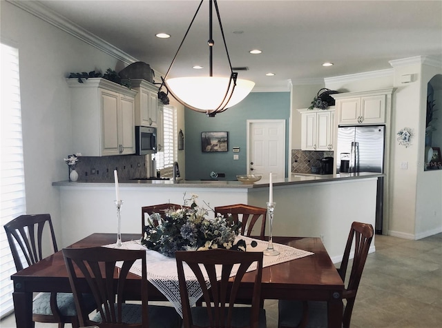 dining space with baseboards, visible vents, ornamental molding, and recessed lighting