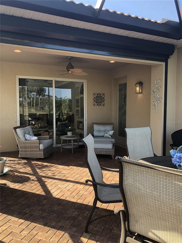 view of patio featuring a ceiling fan