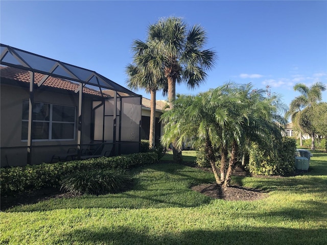 view of yard featuring a lanai