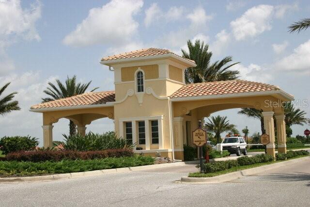 exterior space with a tile roof and stucco siding