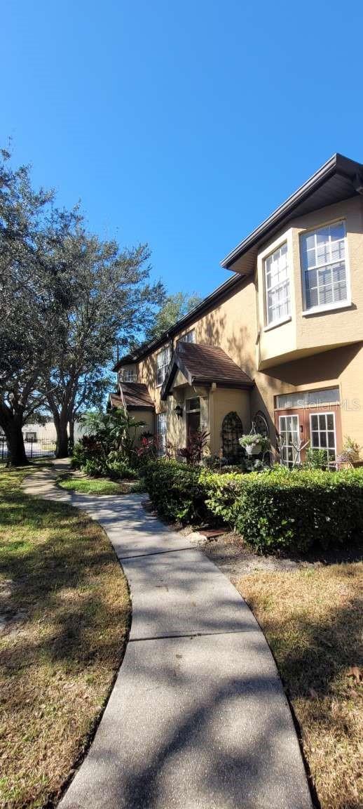 view of side of home featuring stucco siding