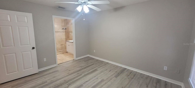 unfurnished bedroom with light wood finished floors, visible vents, baseboards, connected bathroom, and ceiling fan