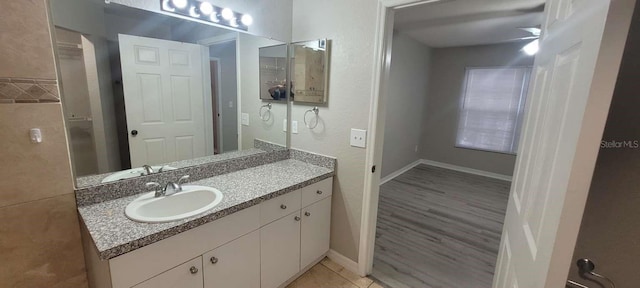 bathroom with baseboards and vanity