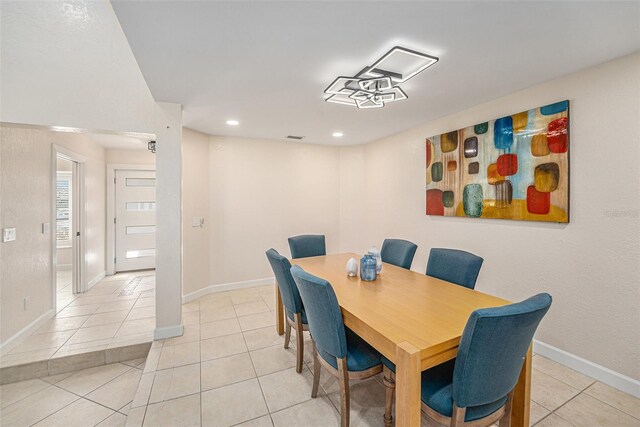 dining area with recessed lighting, baseboards, and light tile patterned flooring