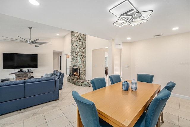 dining space featuring visible vents, a ceiling fan, light tile patterned flooring, a fireplace, and recessed lighting