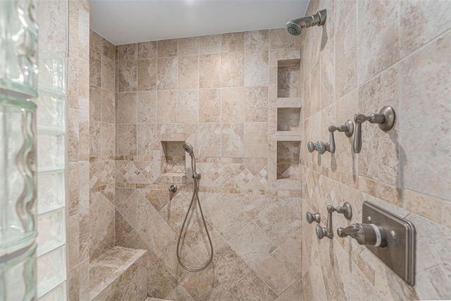 interior space with tiled shower