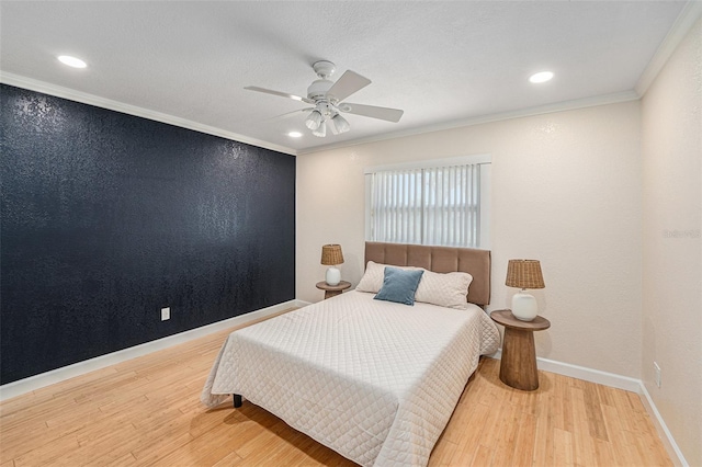 bedroom with baseboards, a ceiling fan, ornamental molding, wood finished floors, and recessed lighting