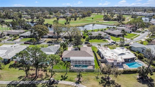 birds eye view of property with a residential view, a water view, and golf course view