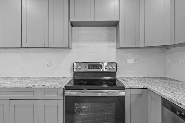 kitchen featuring backsplash, electric range, gray cabinetry, under cabinet range hood, and dishwashing machine