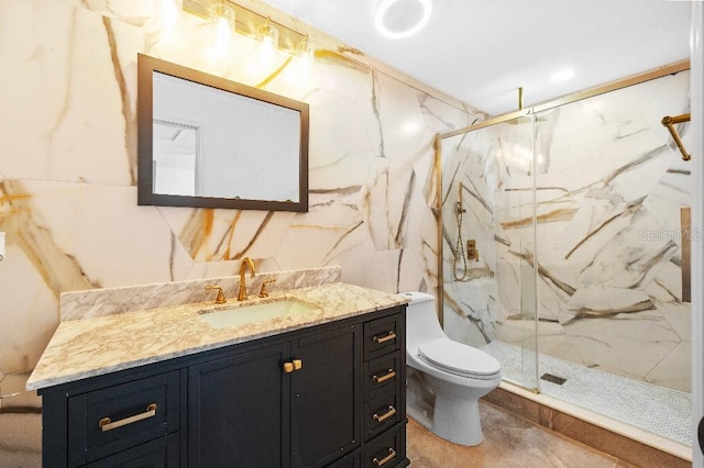 full bathroom with toilet, a marble finish shower, and vanity