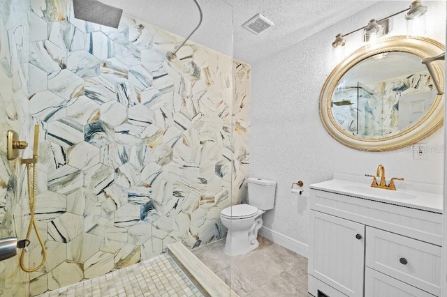 full bath featuring a marble finish shower, visible vents, toilet, a textured ceiling, and vanity