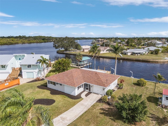 bird's eye view featuring a residential view and a water view