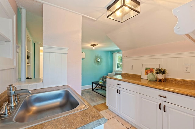 kitchen with white cabinets and a sink